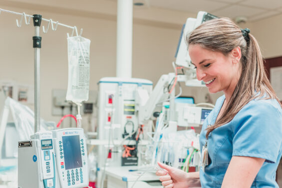 A Carolina Core nurse working with a patient's fluid intake