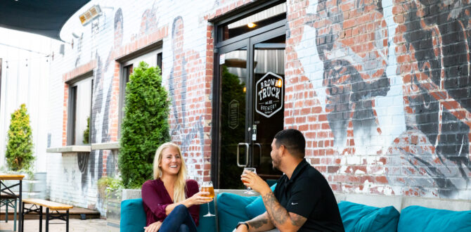 Two people enjoy a drink together at the Brown Truck Brewery in High Point, NC
