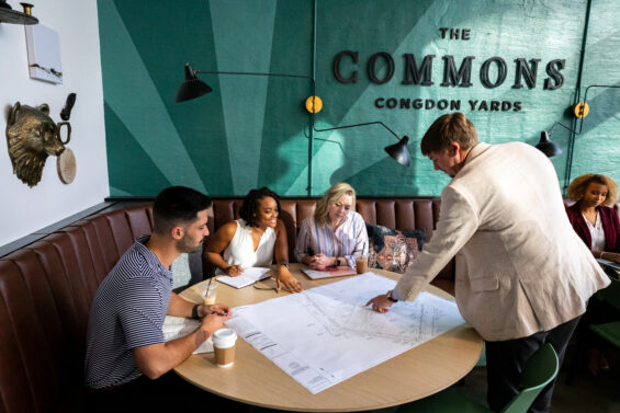 Young professionals review on a design in the Commons Congdon Yards in High Point, North Carolina