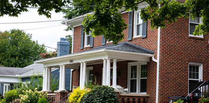 Outside of two-story red brick house.