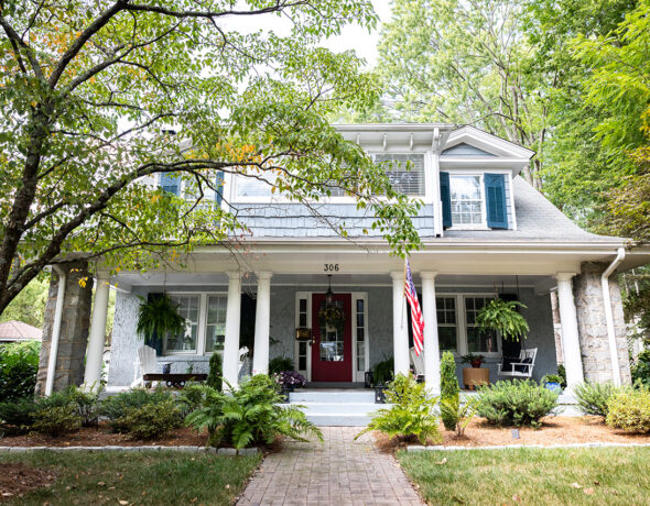 Outside of white, two-story house.